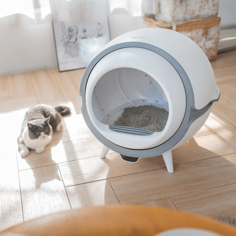 Self-cleaning litter box with UV sterilizer